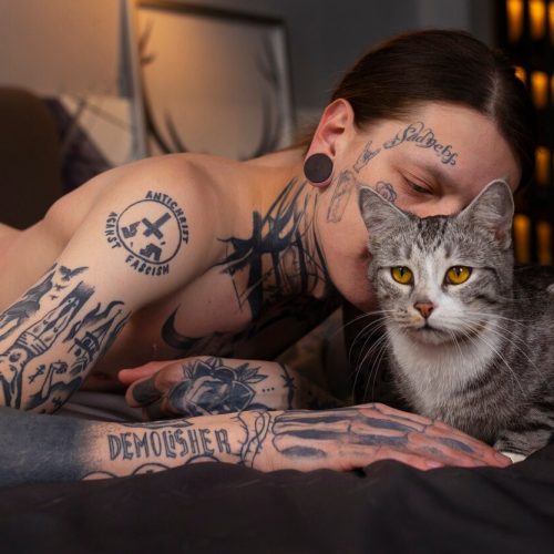 side-view-man-kissing-cat_23-2150233864
